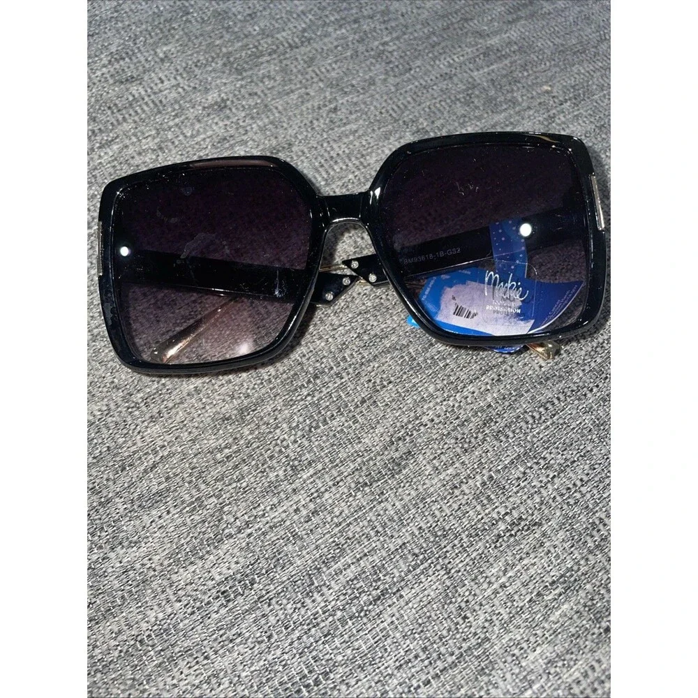 Bob Mackie oversized sunglasses with a black frame and gold accents